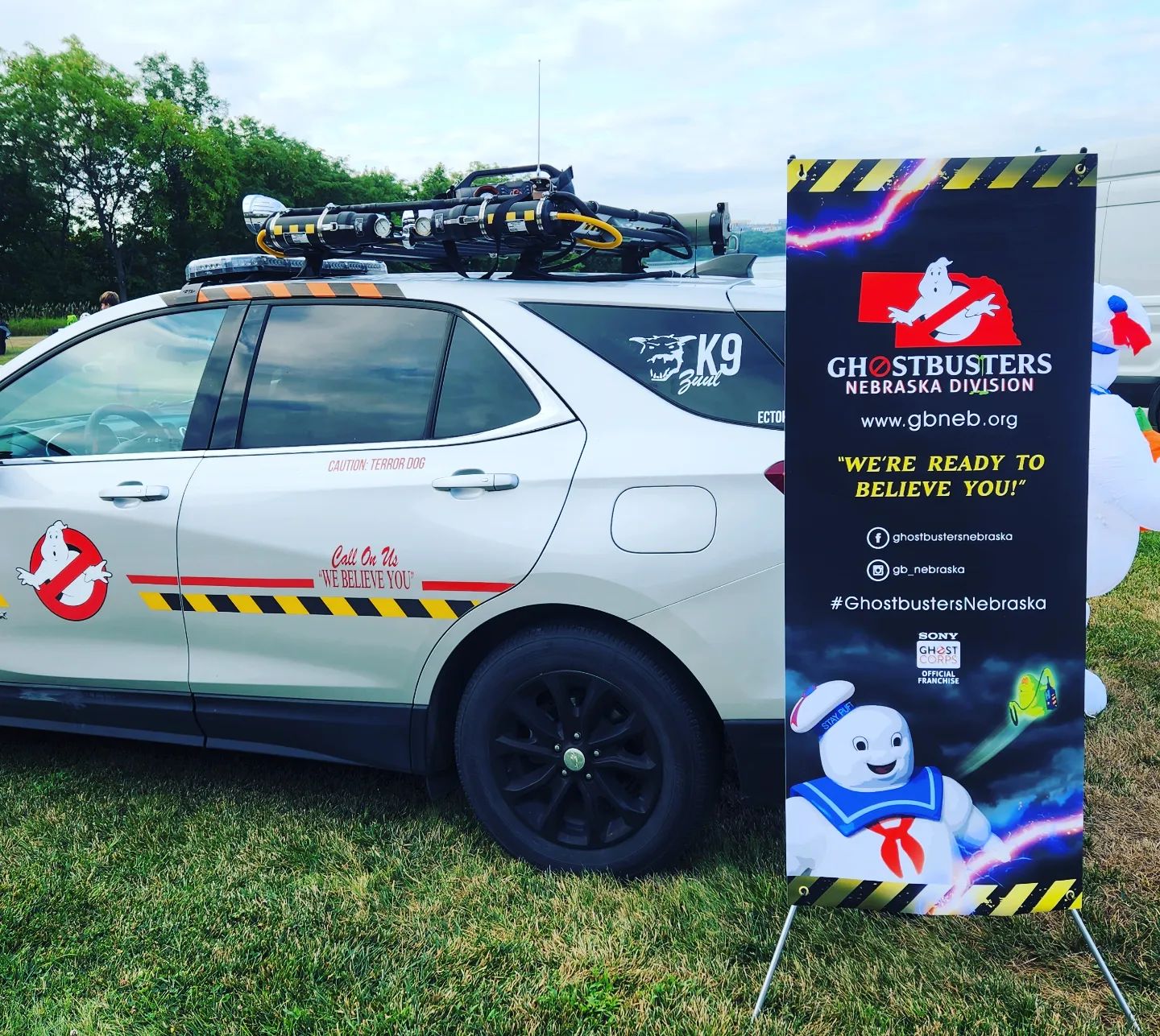 The EctoK9 Unit at an event with the Nebraska Ghostbusters banner.